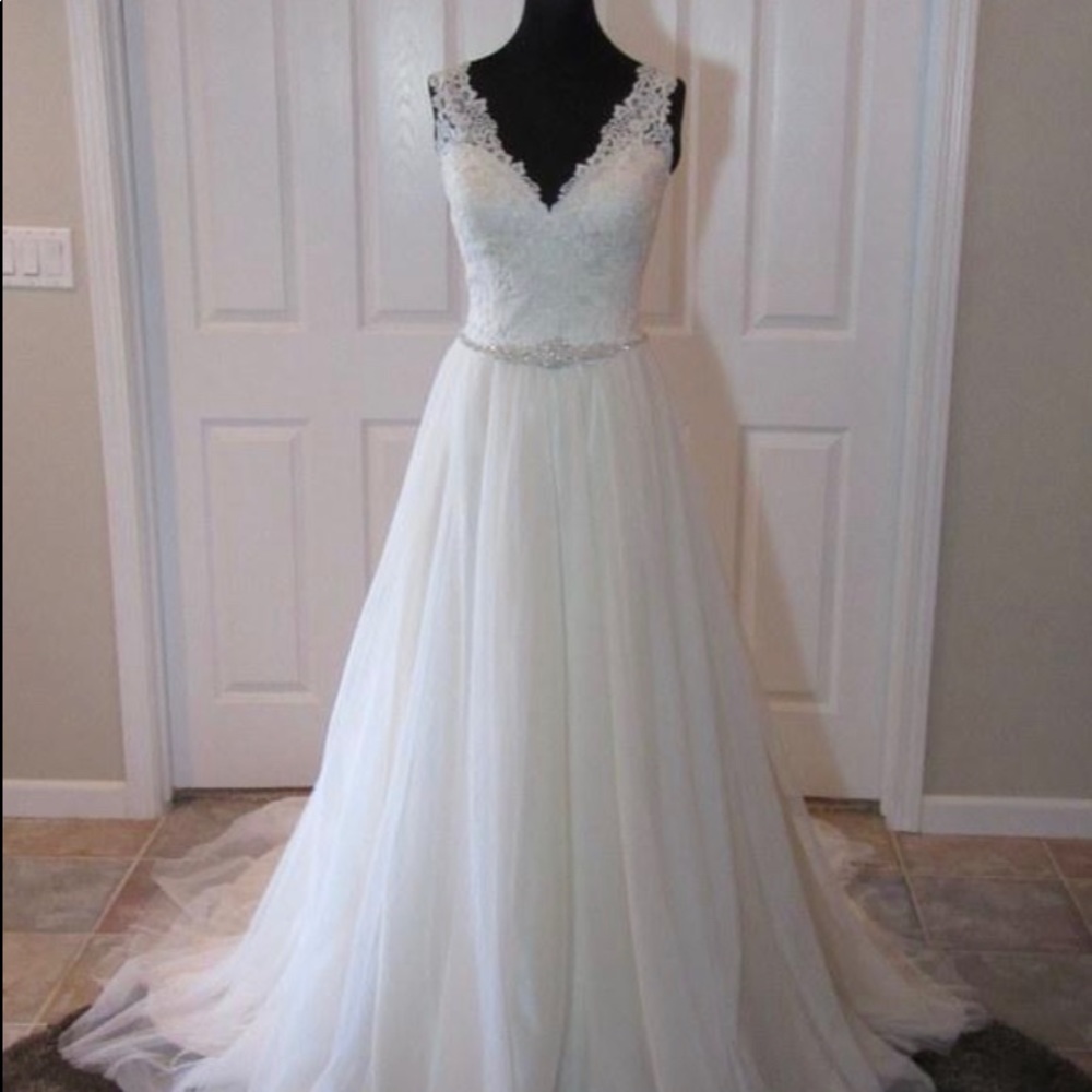 Ivory over gold bridal gown, never used, never alter.